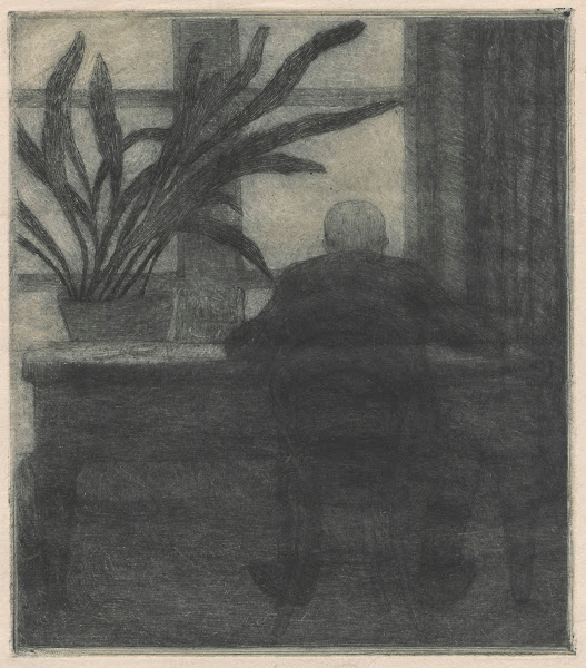 Man sitting at a desk 1909