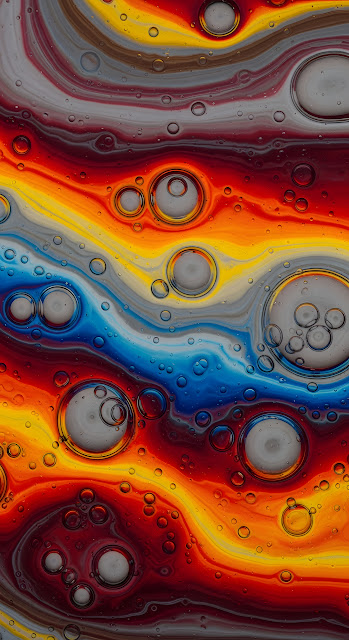 Macro Oil Bubbles on Vibrant Swirling Color Waves - Free mobile Wallpaper