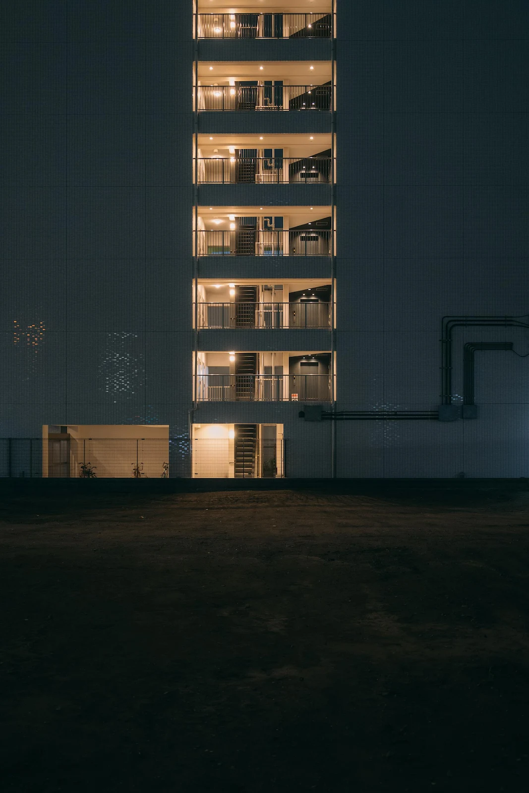 Vertical Apartment Lights In Darkness - Night Architecture 2K iPhone Wallpaper (2000x3000)