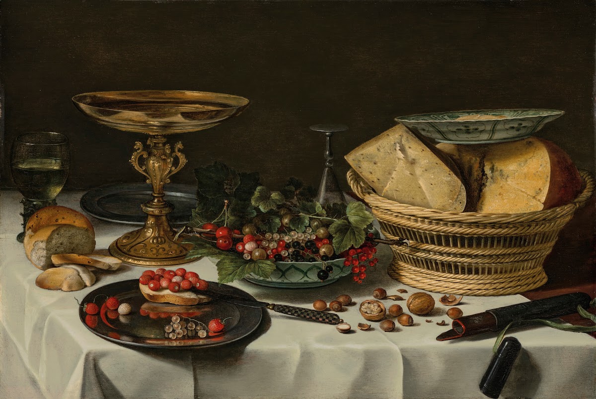 Strawberries currants and bread on a pewter platter