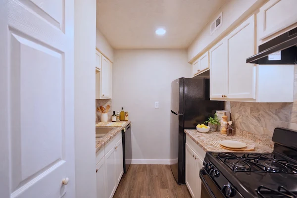 Staged one-bedroom kitchen at The Langston