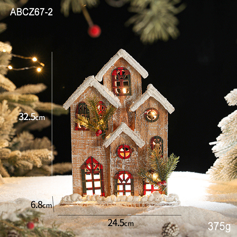 Lit wooden Christmas house in European retro style