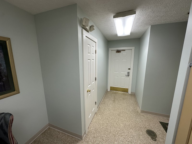 Clubhouse hallway and doors after repaint, smooth painted finish