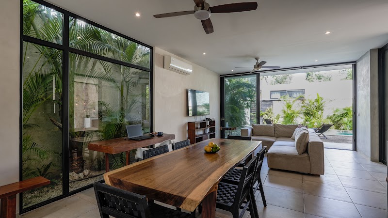 Long dining table open to the terrace