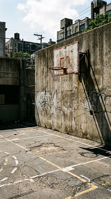 Cinematic Photo of an Urban Basketball Court with High Contrast Shadows and Light - Free mobile Wallpaper