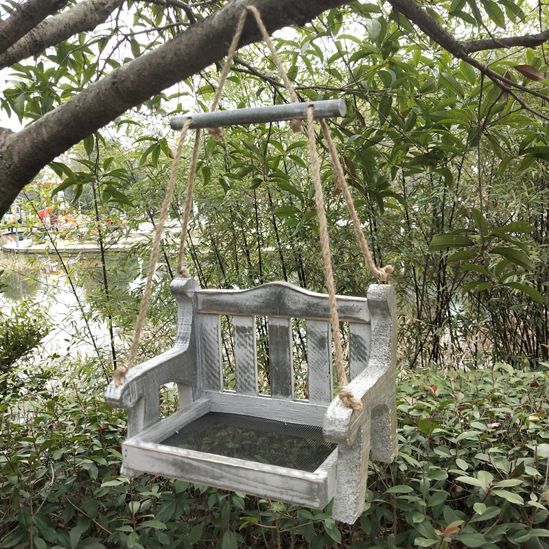 Automatic birdhouse made of pine wood to hang