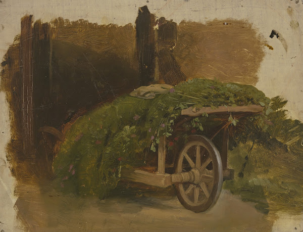 Karren mit geschnittenem Gras beladen