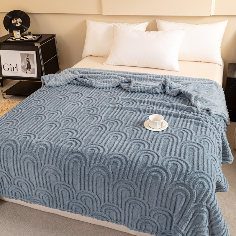 Padded throw blanket with jacquard pattern