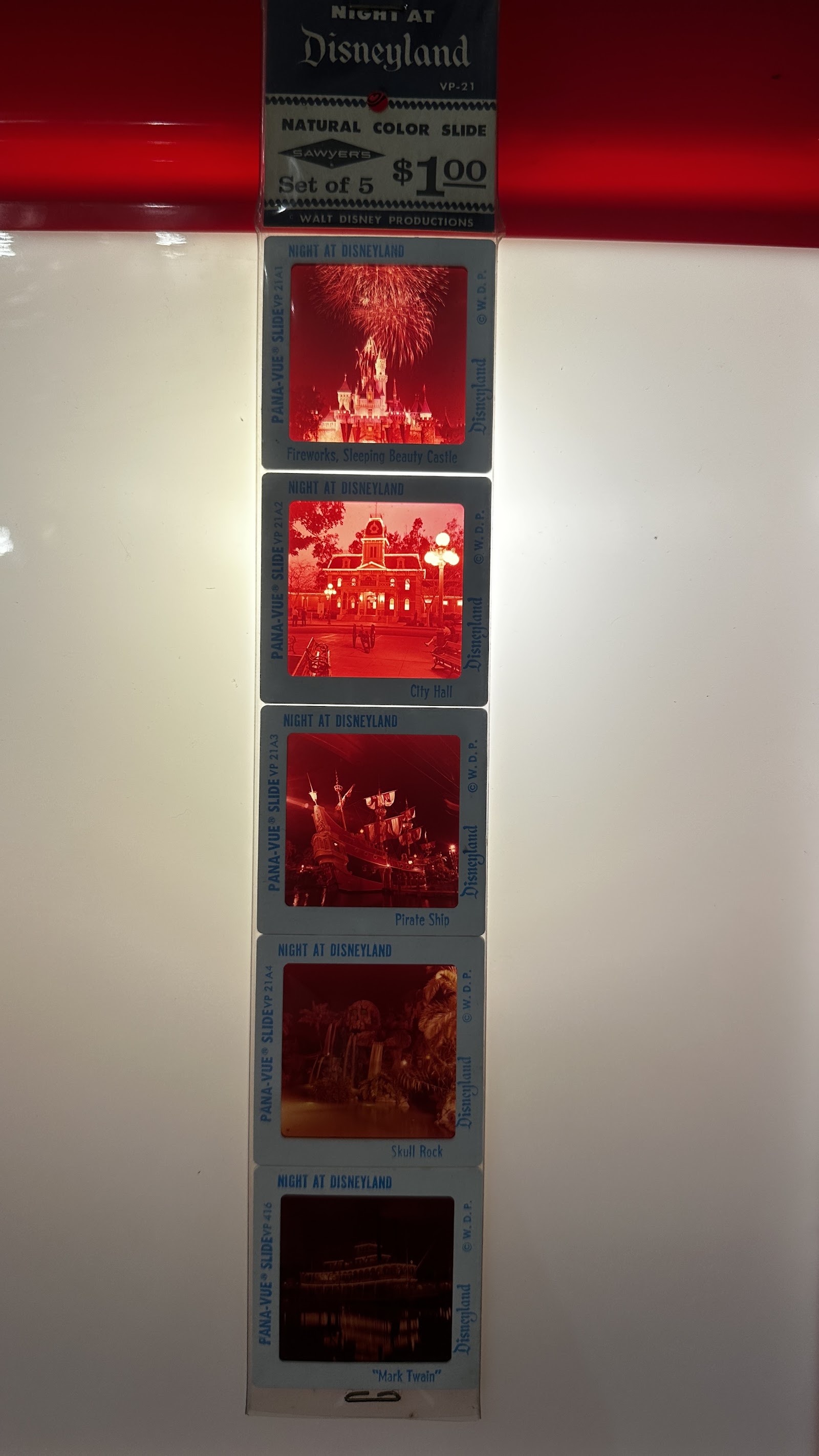 Sawyer's Pana-Vue 35mm slide set VP-21 showing five nighttime Disneyland views including Sleeping Beauty Castle fireworks, City Hall, the Pirate Ship, Skull Rock, and the Mark Twain Riverboat