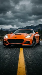Modern High-Performance Orange Grand Tourer on a Dark Road at Night