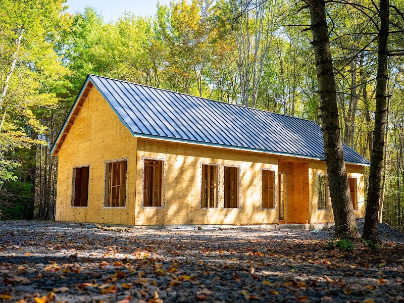 New home construction framing with metal roof — construction photography Hudson Valley