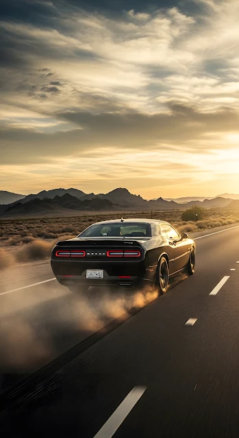 Black Muscle Car Speeding on Desert Highway at Sunset
