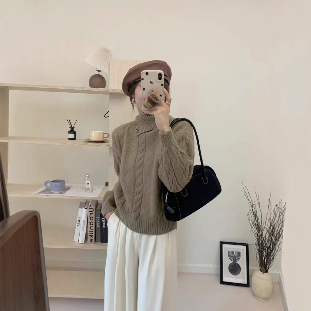 Short cable knit sweater with asymmetrical neckline