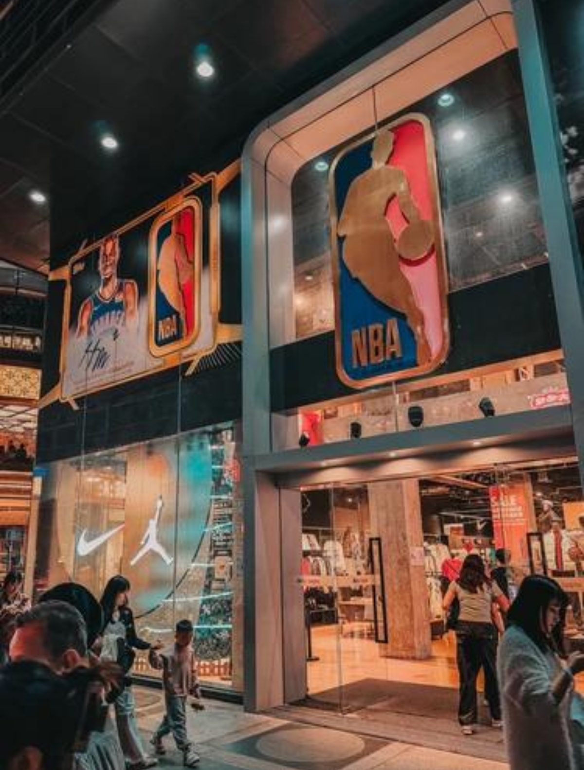 Anta sportswear store display featuring running shoes and training clothes on Beijing Road