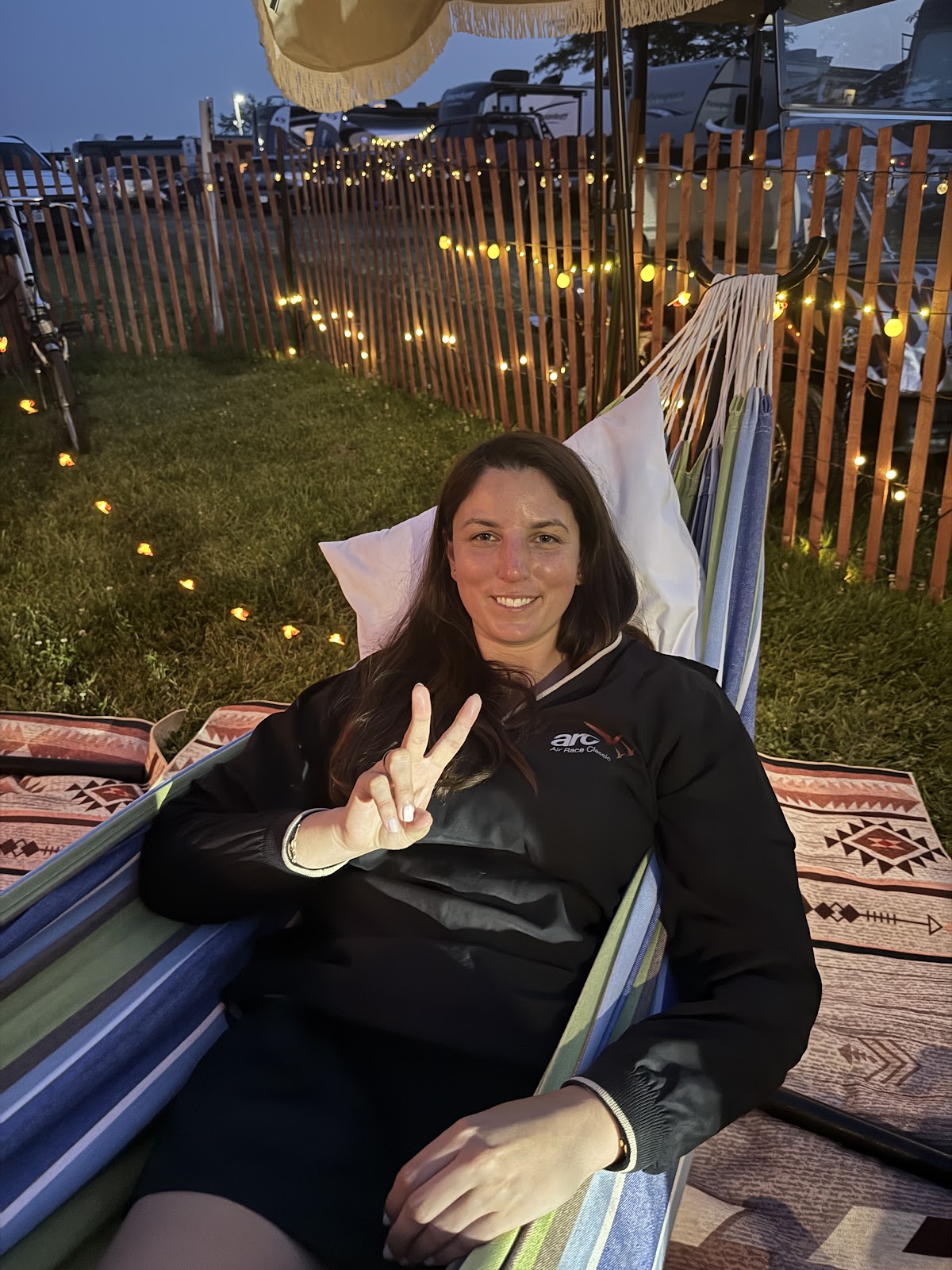 A camper relaxing in a shaded hammock at Camp Abingdon