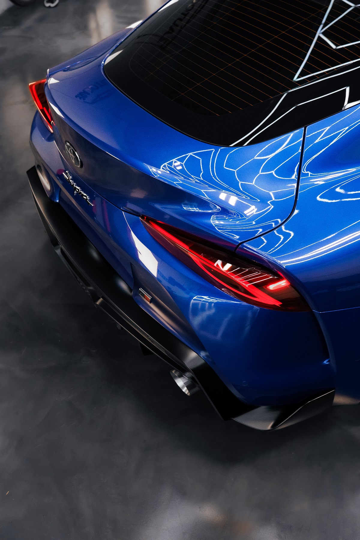 Blue Toyota GR Supra rear with ducktail spoiler detailed at ZAutoCare