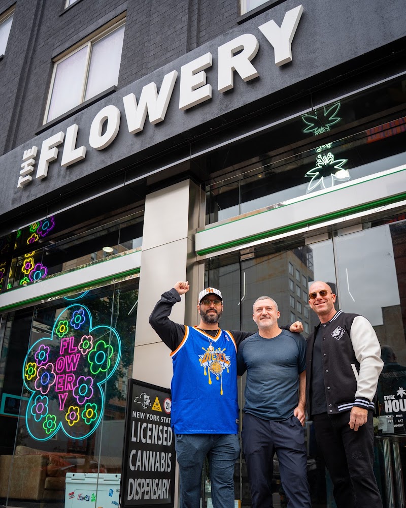 Licensed cannabis dispensary storefront with team — dispensary photography New York