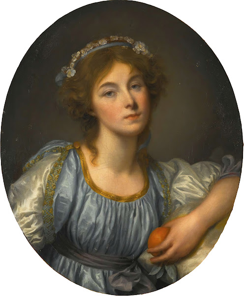 A Young Girl Holding An Orange