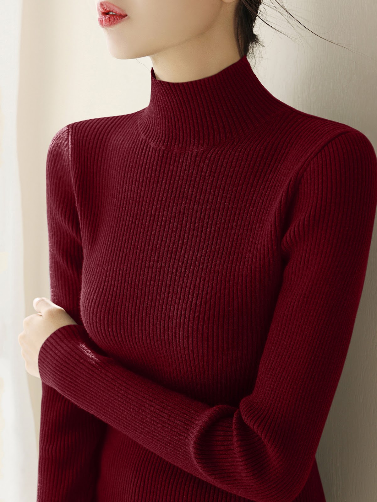 Women's knitted wool sweater with a half-stand collar