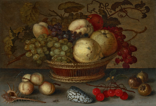 Apples and grapes in a basket with fruit and shells on a stone ledge