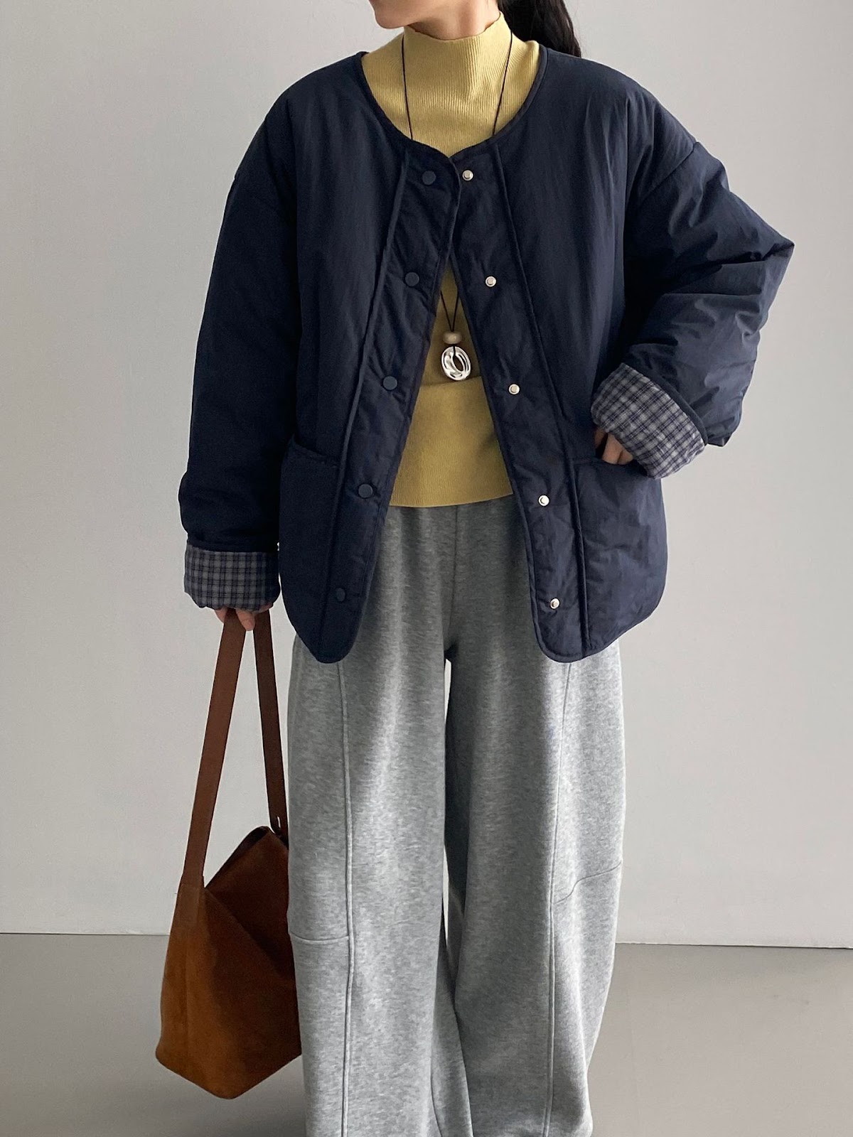 Loose women's quilted jacket in check pattern