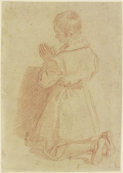 Kneeling praying boy