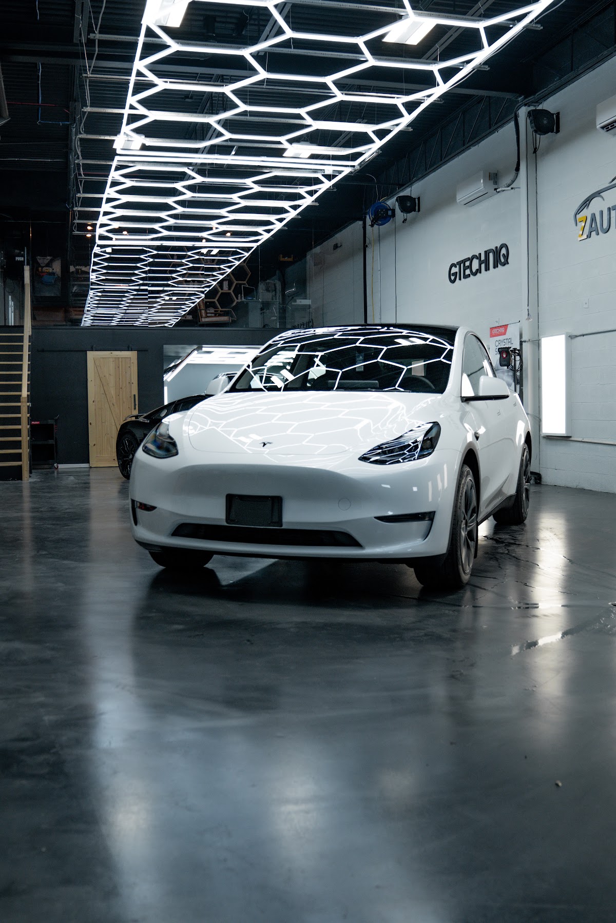 White Tesla Model Y in the ZAutoCare Waterloo studio