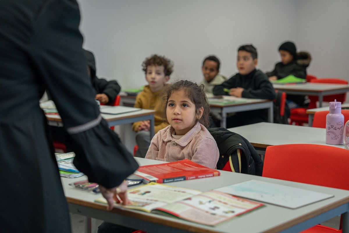 Young students listening attentively in class