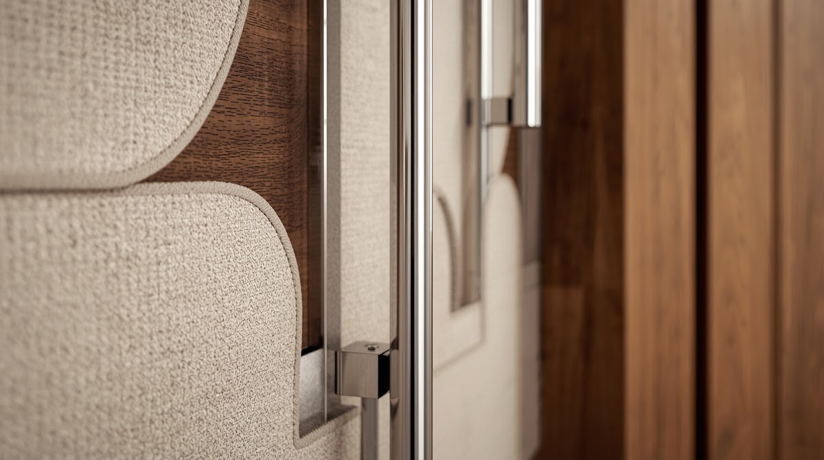 How to Brighten a Dark Entryway With Chrome Wall Decor - chrome detail beside warm wood grain and textured fabric