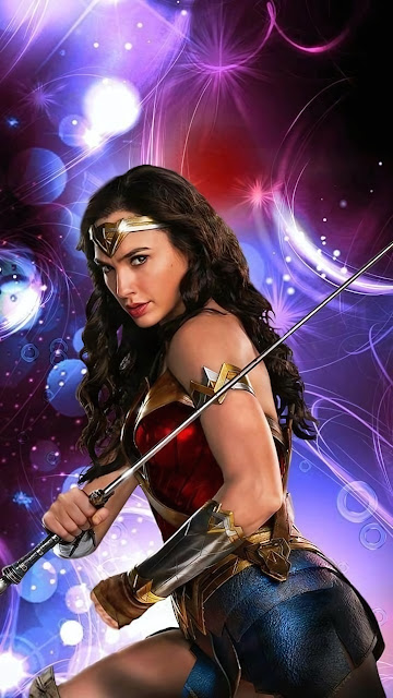 Wonder Woman holding a sword in armored costume against a backdrop of purple and magenta glowing lights.