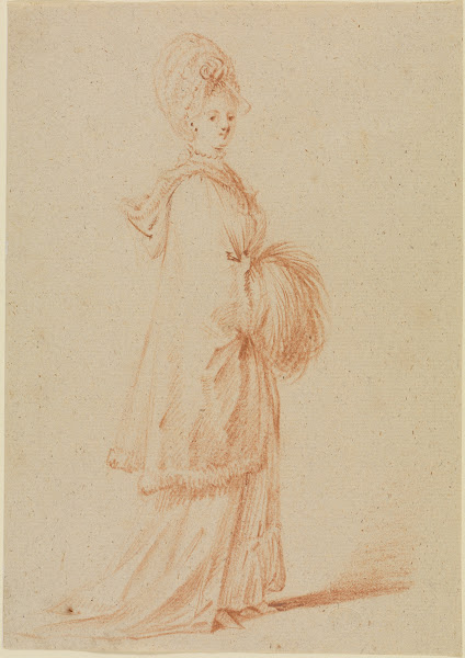 Junge Dame im Cape mit Kapuze und Muff