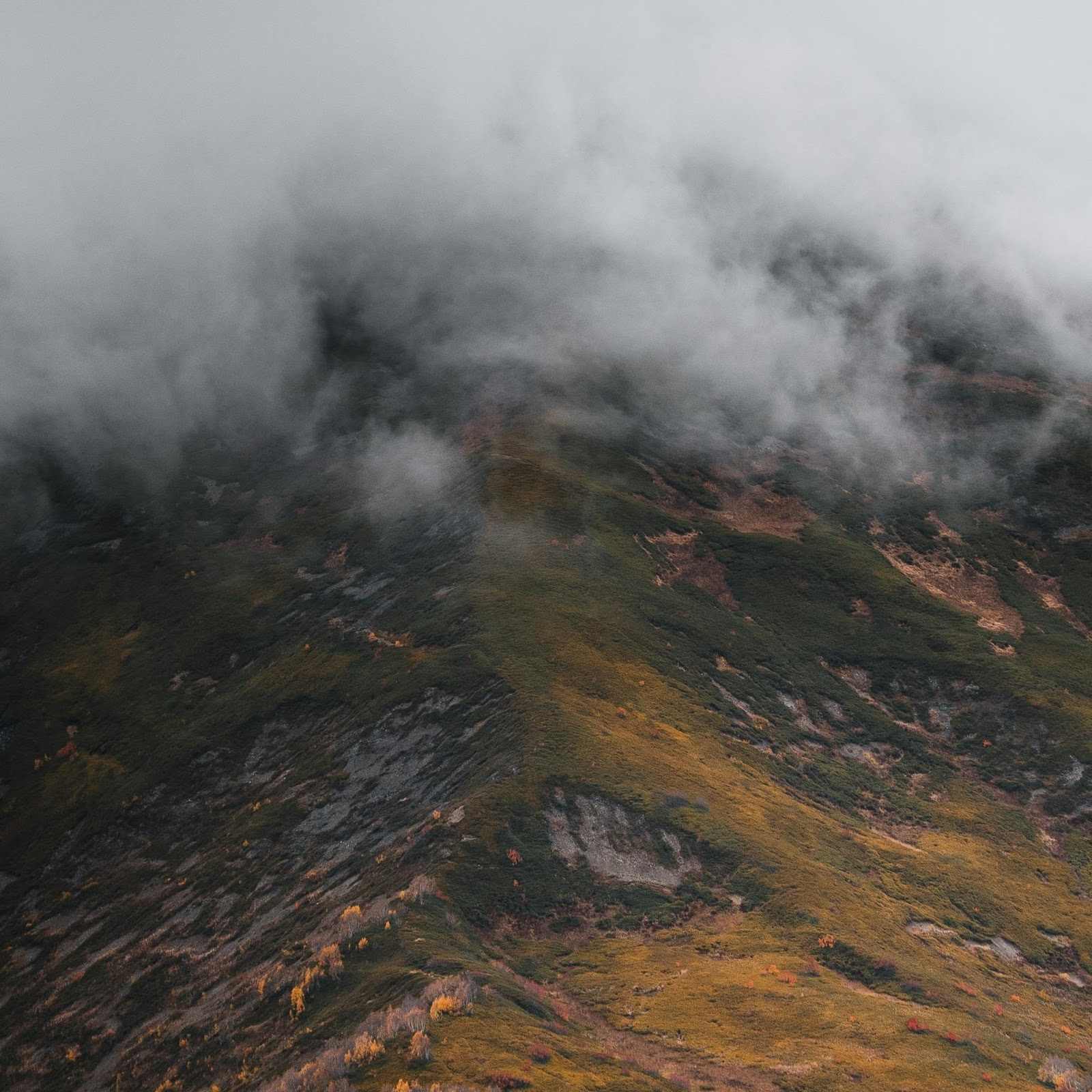 Download Moody Mountain Peak Under Clouds 2K iPhone