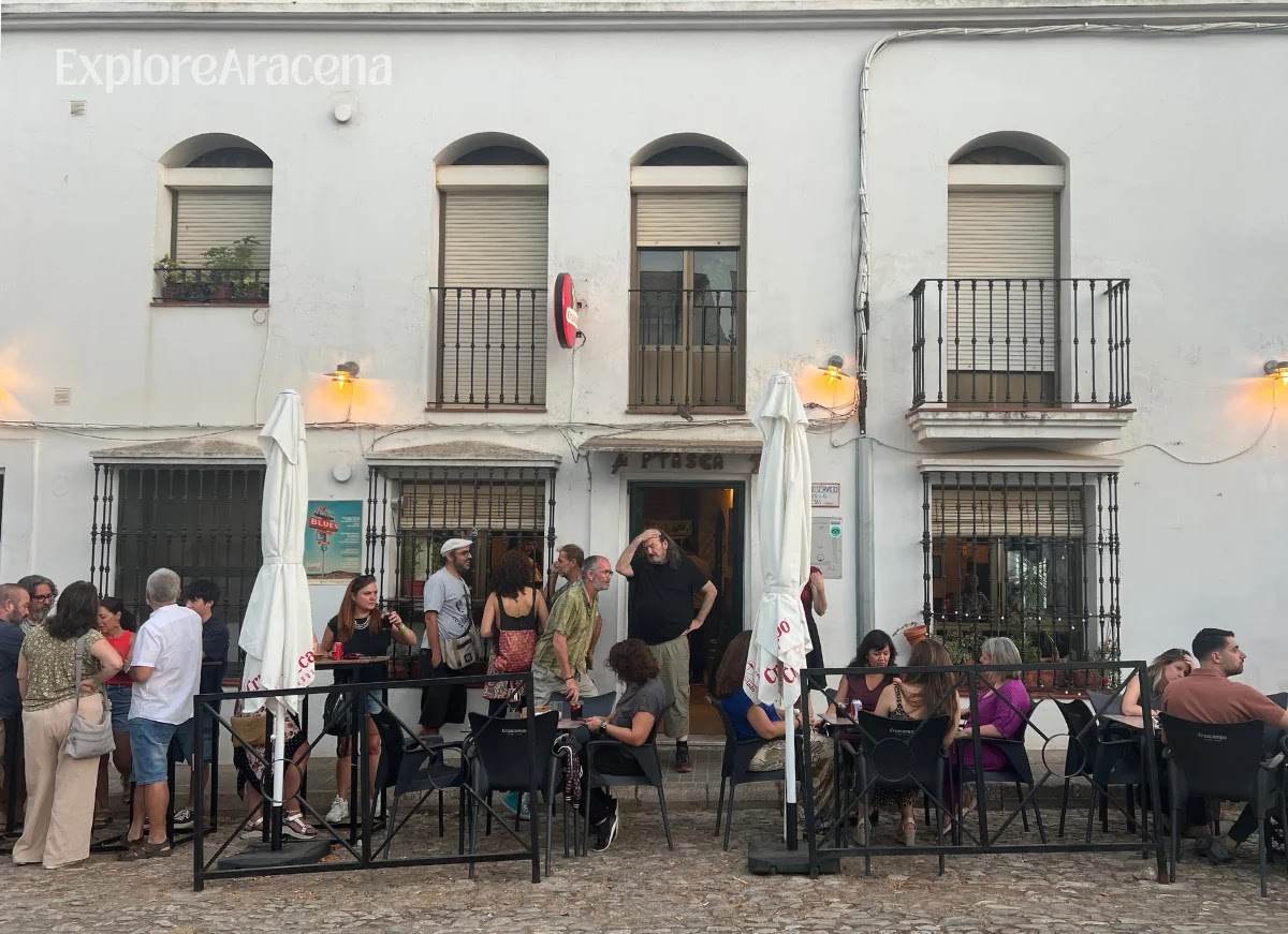 Festival-goers having pre-show drinks outside Bar P’Tasca, opposite the Plaza de Toros in Aracena.