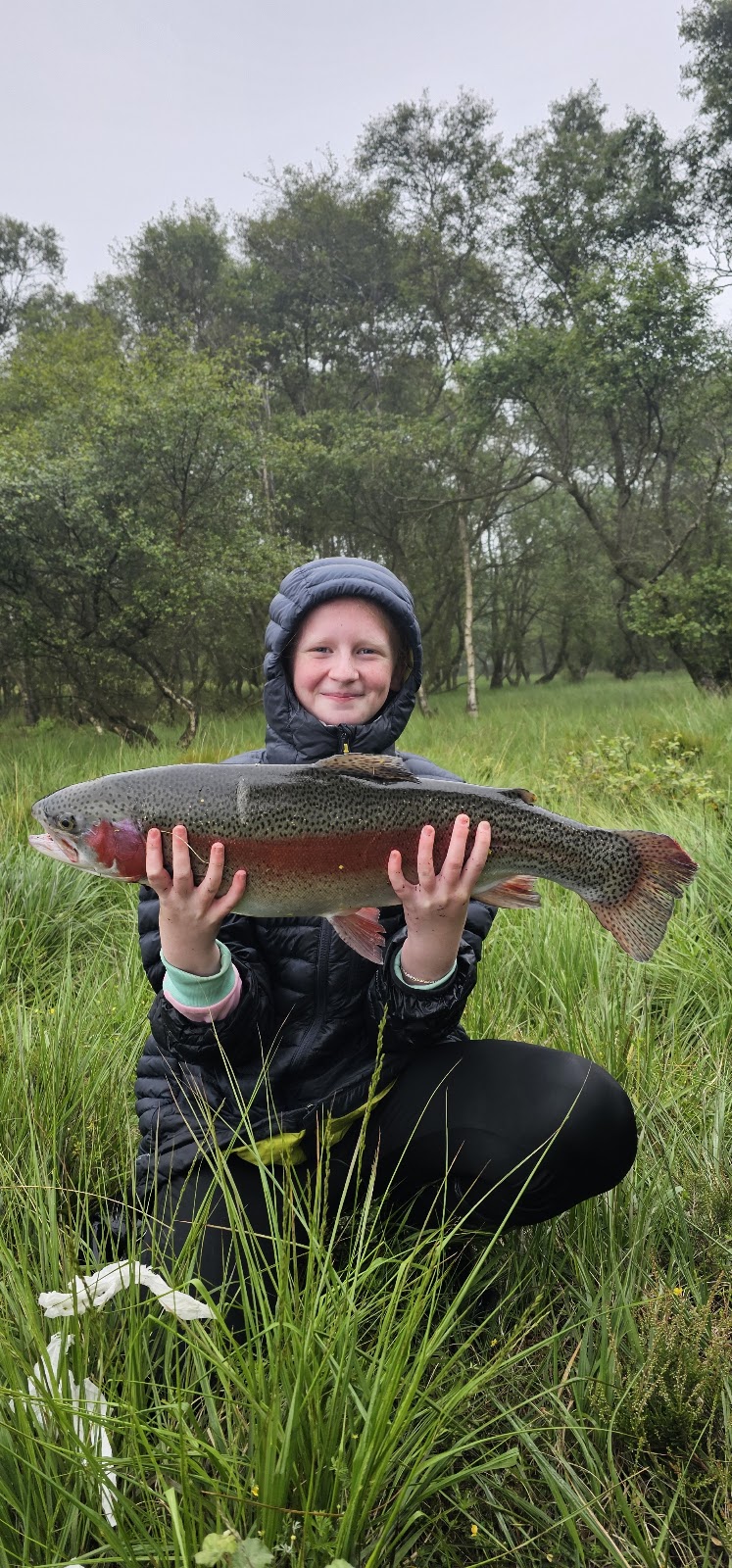 Iona McNaughton with a 9lb 12oz Rainbow Trout winning first place at Roughrigg Fishery