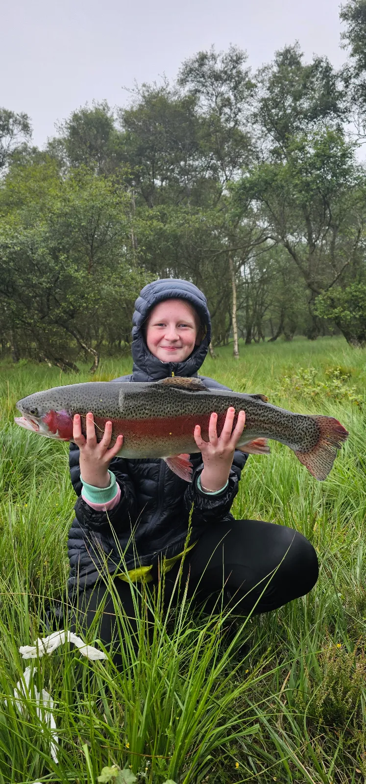 Iona McNaughton with a 9lb 12oz Rainbow Trout that won first place at a Roughrigg Fishery Competition
