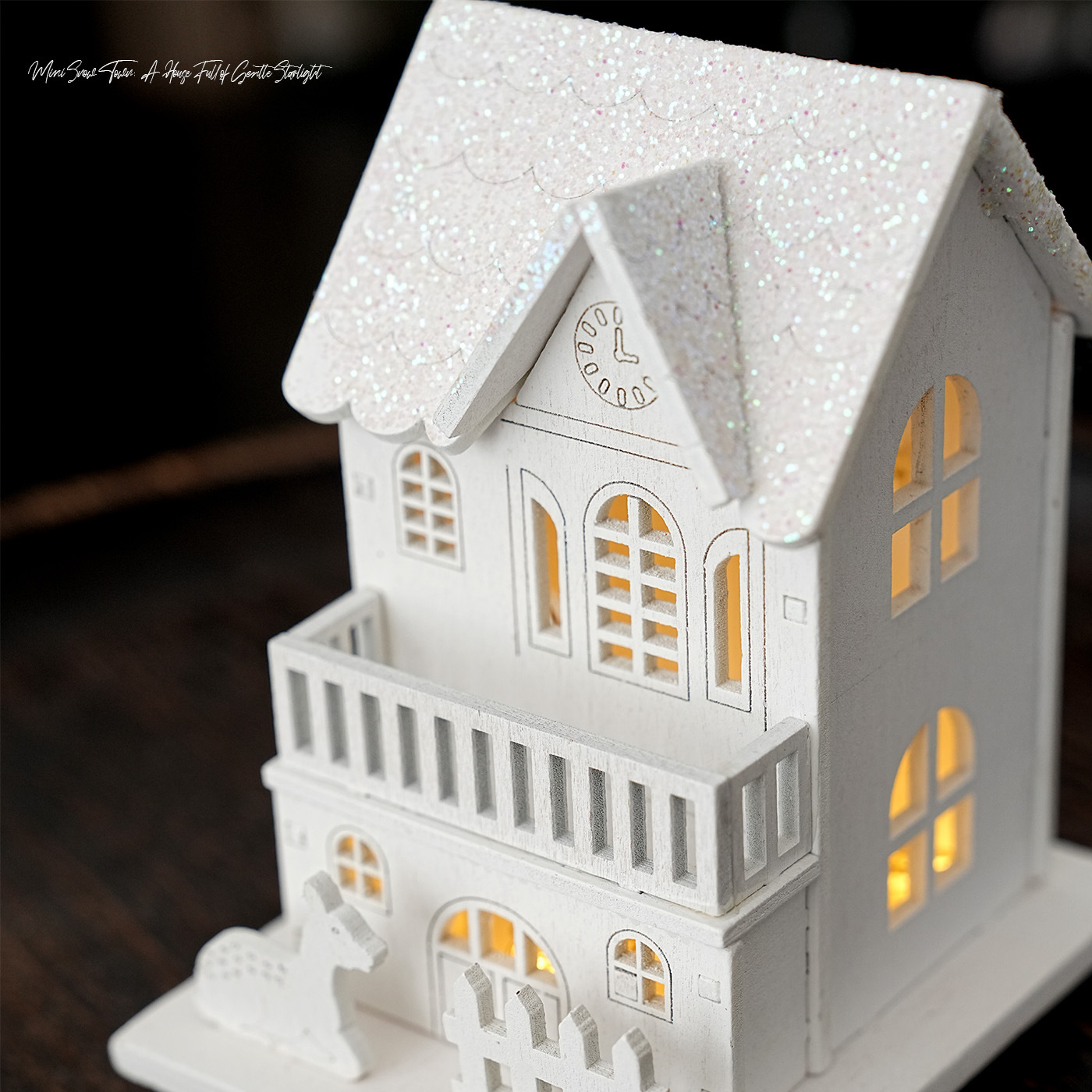 Illuminated wooden house for Christmas decoration