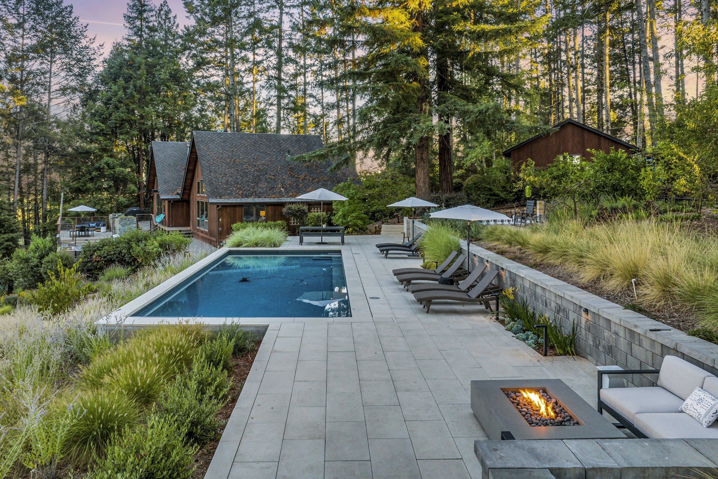 Casa de Lucca pool and fire pit at twilight