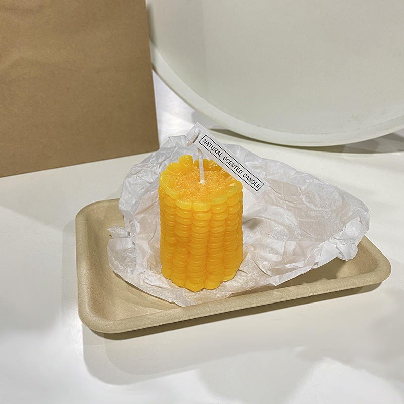 Handcrafted scented candle made of soy wax, fruit shape