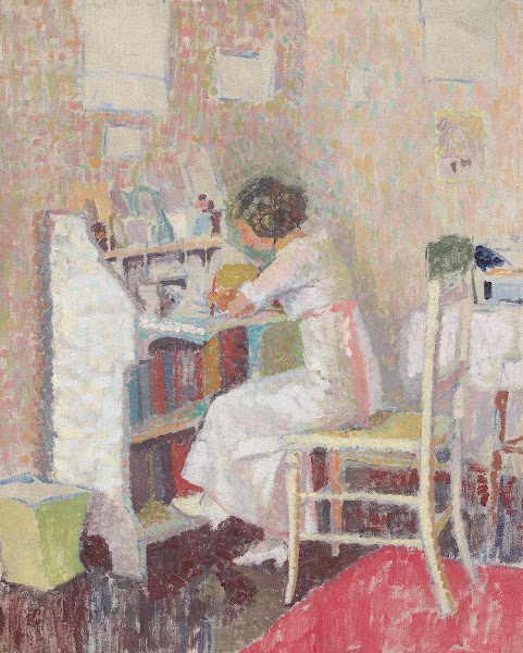 Girl sitting at a writing table circa 1919
