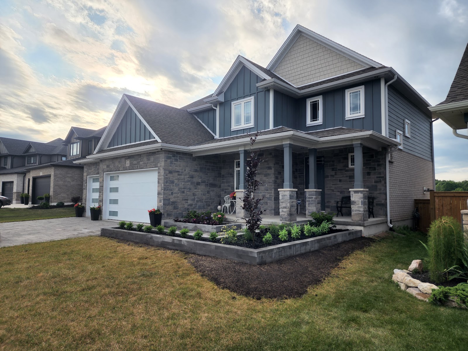 Backyard garden bed mulching and tree planting in London, Ontario