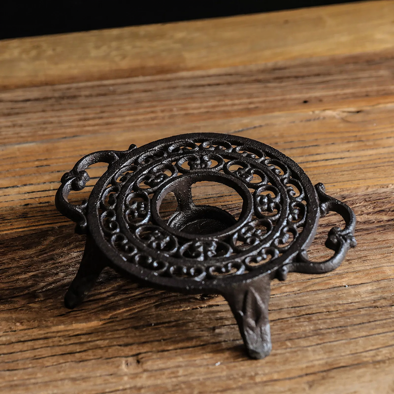 Cast iron teapot warmer with burner stand
