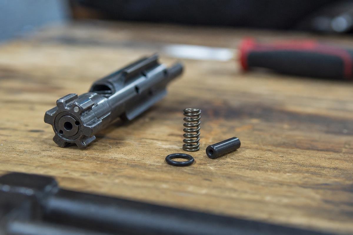 standard AR-15 extractor spring and O-ring setup comparison