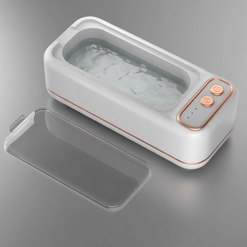 Ultrasonic cleaning device, portable, dual chamber