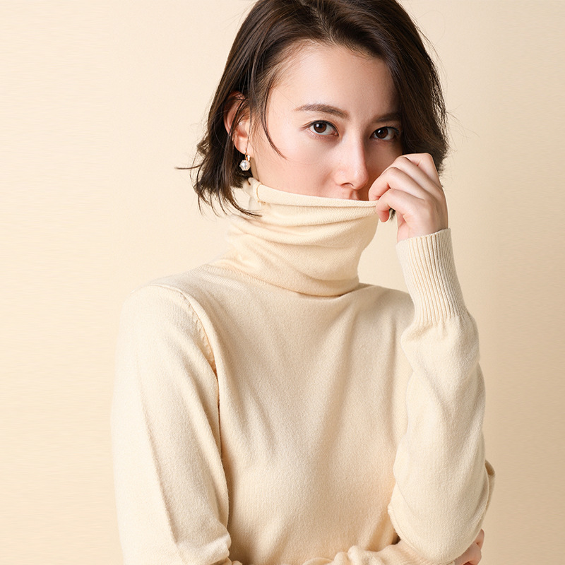 Women's knit sweater with standing collar and geometric pattern