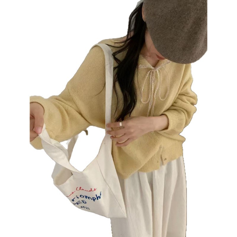 Women's cardigan with lace collar and tie