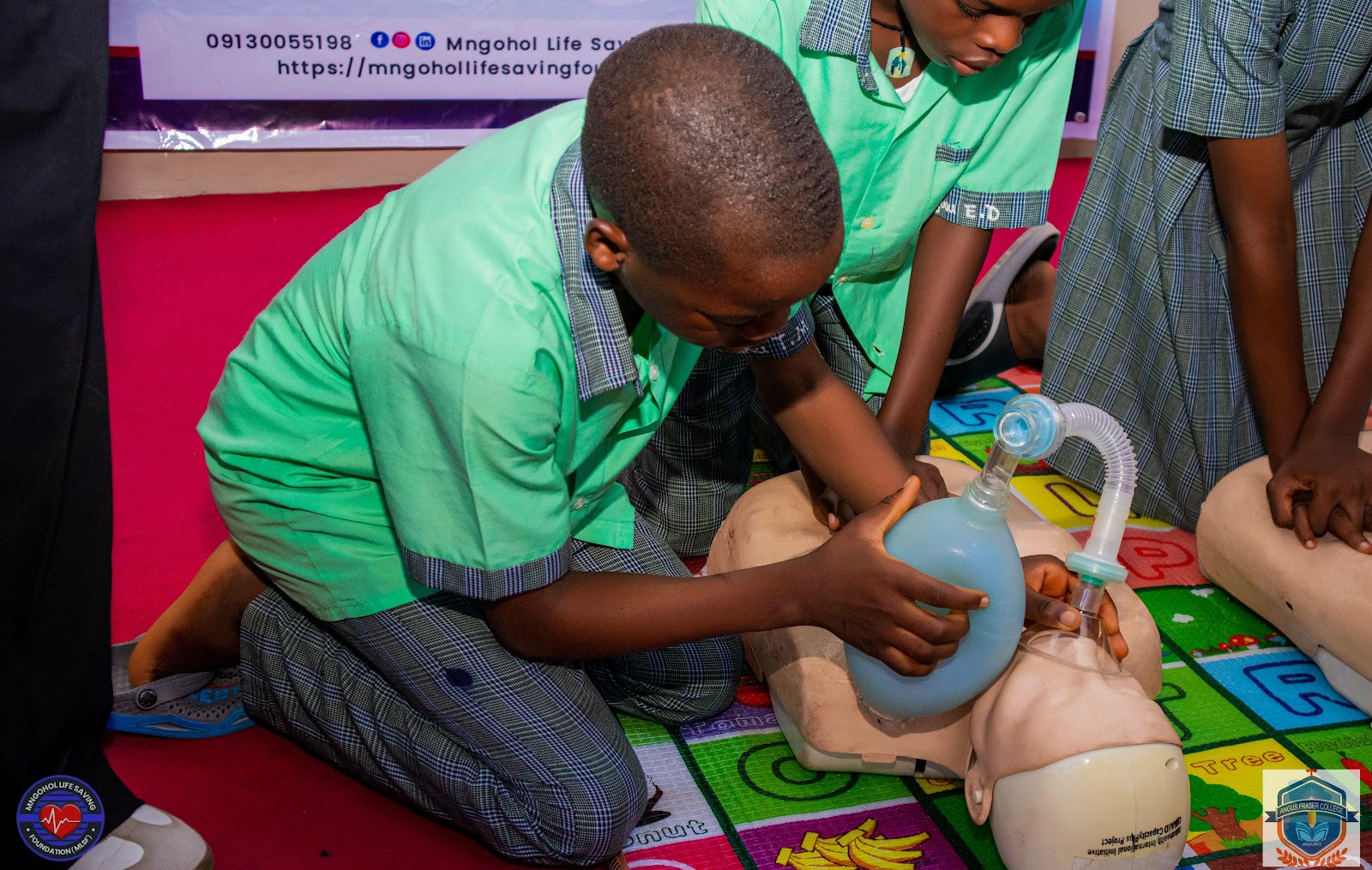 Community members participating in life-saving training