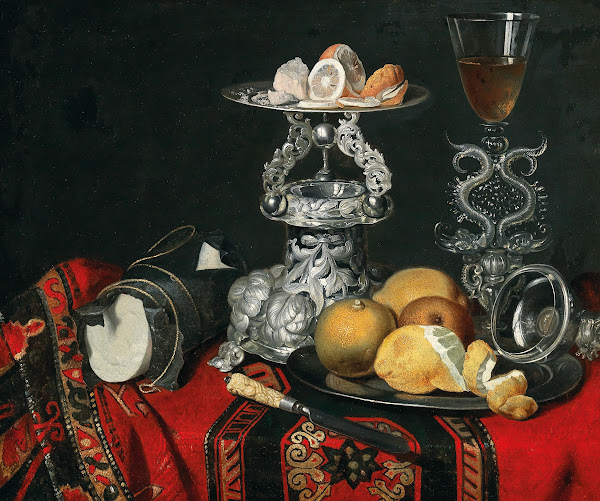 A still life with a Venetian glass a silver vessel and lemons