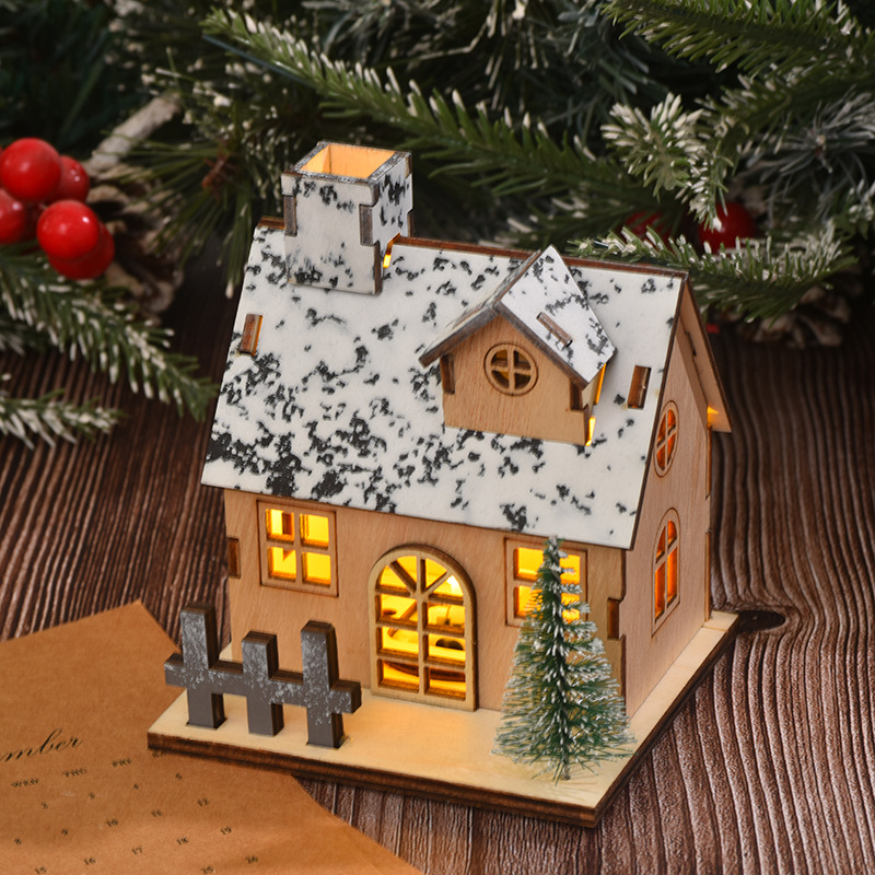 Illuminated wooden Christmas house with LED