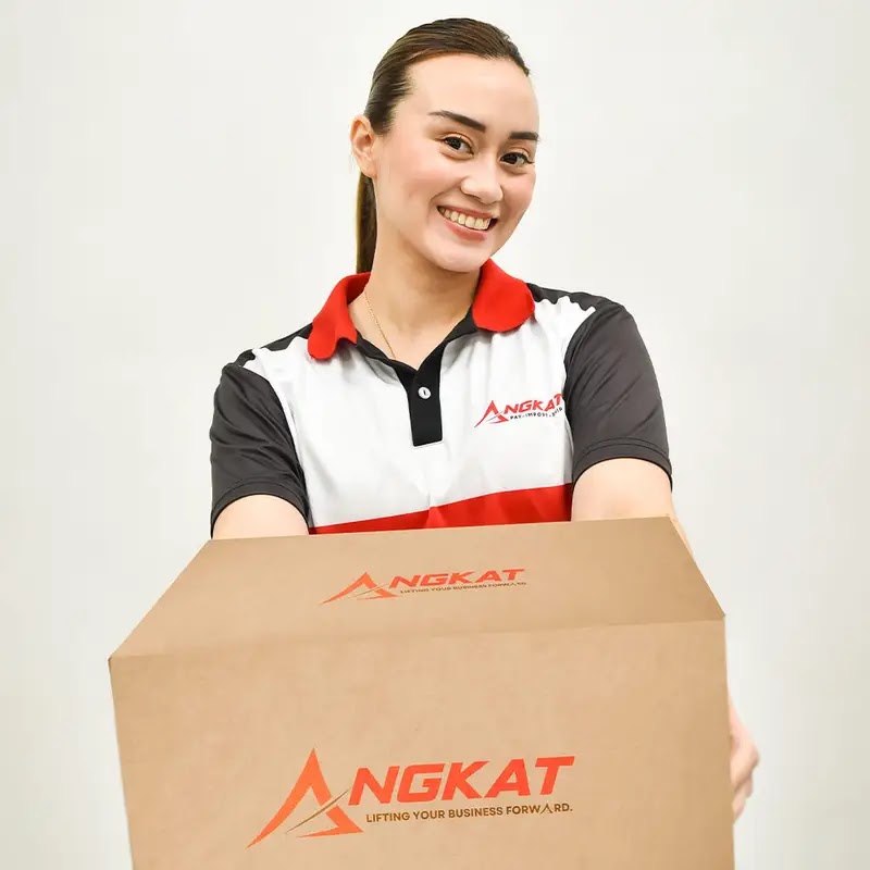 Angkat staff handing over a branded parcel