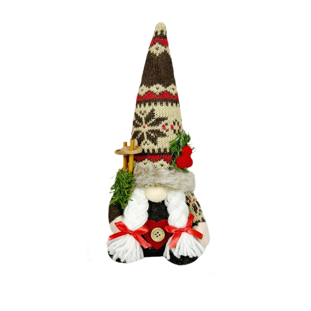 Christmas gnome figure with knitted hat and branch